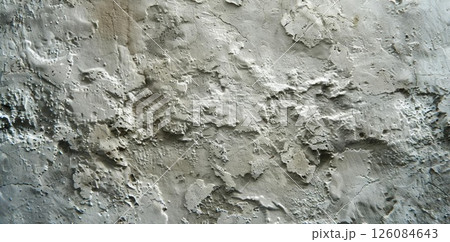 Weathered Charm. Rough, uneven, and textured stucco, wall or building texture. 126084643
