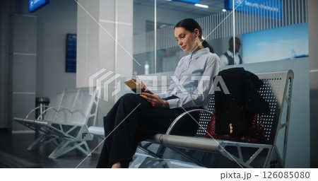 Airport Terminal: Successful Businesswoman with Bag and Documents Using Smartphone 126085080