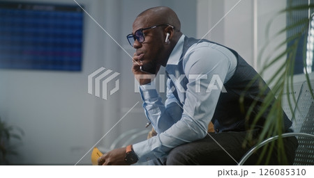 Airport Terminal: Businessman Angry About Delayed Flight Talking and Shouting in Smartphone Airport Terminal: Businessman Angry About Delayed Flight Talking and Shouting in Smartphone 126085310