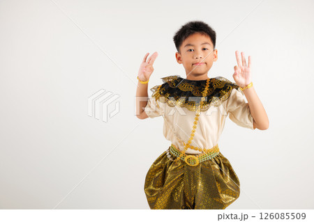 Portrait Thailand kid boy smiling traditional Thai dress costume showcases the OK sign with smile, conveying agreement and positivity, studio isolated white background, primary child success sign Portrait Thailand kid boy smiling traditional Thai dress costume showcases the OK sign with smile, conveying agreement and positivity, studio isolated white background, primary child success sign 126085509
