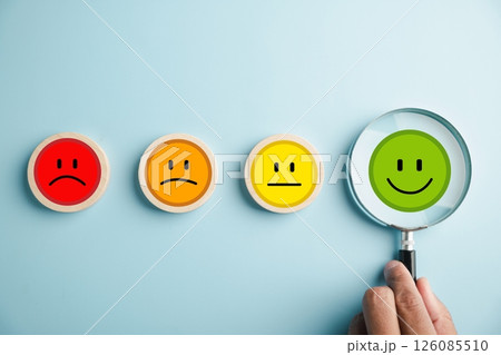 Magnifier in hand selected happy smiley face icon among emotions. Good feedback rating, positive customer review. Experience, satisfaction survey, mental health. Certificate demonstrates satisfaction. Magnifier in hand selected happy smiley face icon among emotions. Good feedback rating, positive customer review. Experience, satisfaction survey, mental health. Certificate demonstrates satisfaction. 126085510