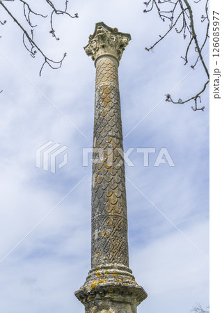 Ancient roman column standing tall in Cussy la Colonne, France, reaching for the sky Ancient roman column standing tall in Cussy la Colonne, France, reaching for the sky 126085977
