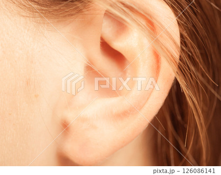 Close up on female ear 126086141