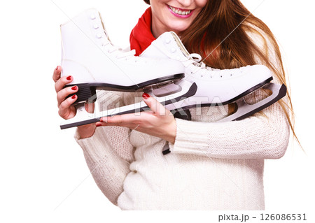Smiling woman with ice skates 126086531