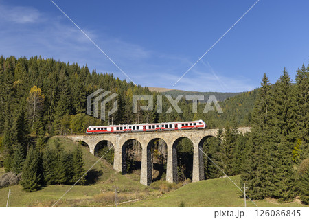 Modern diesel train, railway bridge Chramossky viadukt near Telgart, Horehronie, Slovakia Modern diesel train, railway bridge Chramossky viadukt near Telgart, Horehronie, Slovakia 126086845