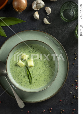 Soup of wild garlic, potatoes, onions and cream 126086880