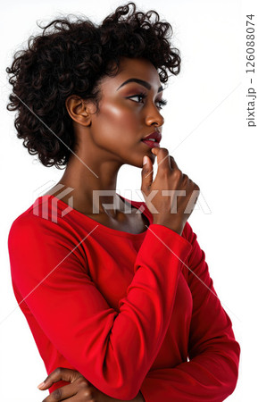 Pensive Woman in Red Top Isolated A medium shot shows a Black woman with curly dark hair, wearing a red 126088074