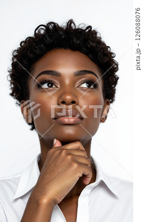 Woman Contemplating Idea Isolated A medium shot captures a Black woman with short curly hair, wearing a white collared shirt 126088076
