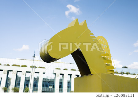Yellow winged horse sculpture on city lawn Yellow winged horse sculpture on city lawn 126088111