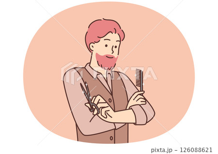 Man hairdresser from beauty salon stands with arms crossed holding comb and scissors 126088621
