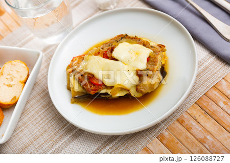 Just cooked eggplants with ground meat and cheese Just cooked eggplants with ground meat and cheese 126088727