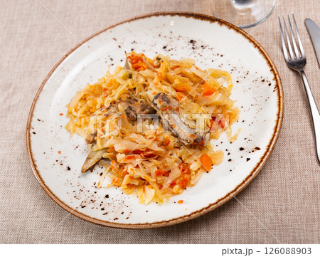 Delicious pork ribs stewed in gravy with sauerkraut close up 126088903