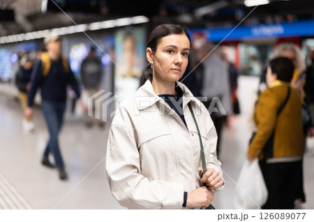 Portrait of woman at metro station waiting for train 126089077