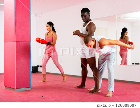 Sparring of two men at self-defense training in sports club Sparring of two men at self-defense training in sports club 126089087