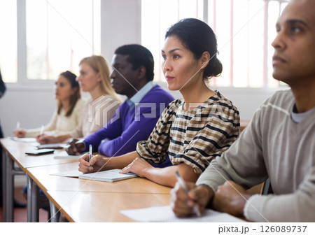 Interested adult korean woman on lesson in school auditorium 126089737