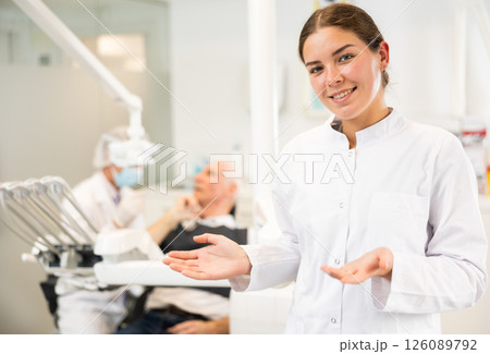 Young woman nurse is standing in dental office, clinic Young woman nurse is standing in dental office, clinic 126089792