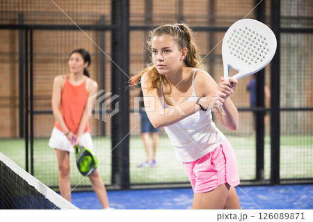 Woman playing padel tennis on padel court Woman playing padel tennis on padel court 126089871