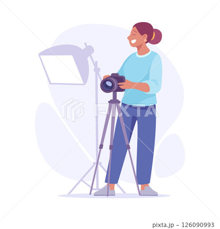 A Smiling Photographer Holding a Camera and Featuring Lighting Equipment for a Photoshoot 126090993