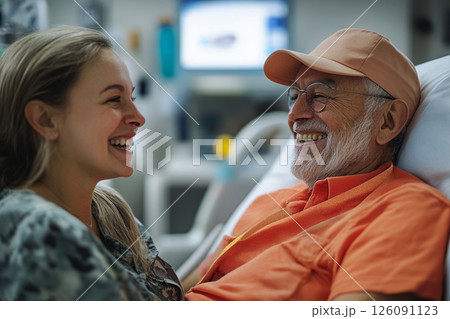 A happy nurse and patient share a joyful moment in a recovery room, the nurse offering support while the patient expresses relief, trust, and heartfelt gratitude 126091123