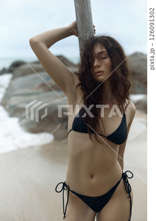Beautiful young woman on beach. pretty Sexy girl in Bikini near sea 126091302