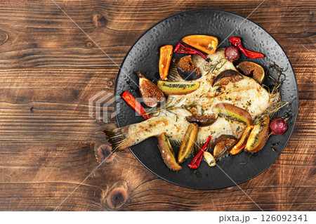 Cambala fish in a fruit marinade. 126092341