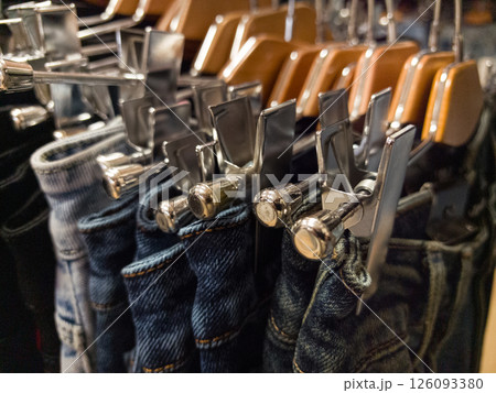 Discover stylish trousers on sale at a trendy clothing store showcase Discover stylish trousers on sale at a trendy clothing store showcase 126093380