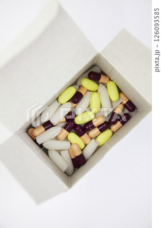 Medical pills in a cardboard box package. Medical pills in a cardboard box package. 126093585
