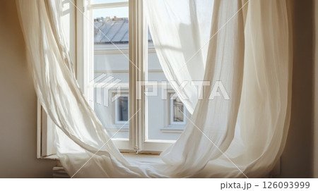 White Sheer Curtains Blowing in a Gentle Breeze, Illuminating a City View White Sheer Curtains Blowing in a Gentle Breeze, Illuminating a City View 126093999