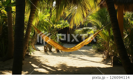 Golden Hammock Hanging in Tropical Beach Setting 126094114