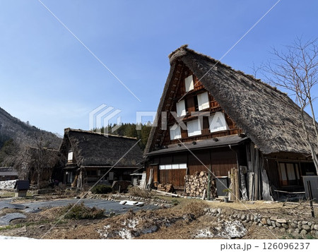 Shirakawa-go is historic village in Gifu Prefecture, famous for its gassho-zukuri farmhouses with steep thatched roofs, a UNESCO World Heritage Site. Shirakawa-go is historic village in Gifu Prefecture, famous for its gassho-zukuri farmhouses with steep thatched roofs, a UNESCO World Heritage Site. 126096237