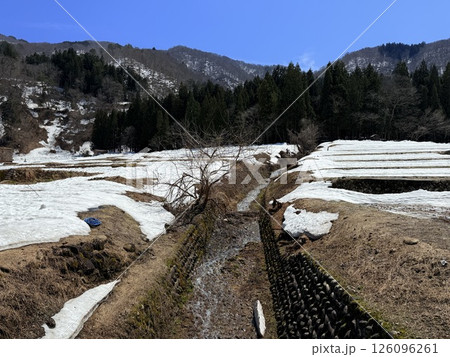 Shirakawa-go is historic village in Gifu Prefecture, famous for its gassho-zukuri farmhouses with steep thatched roofs, a UNESCO World Heritage Site. 126096261