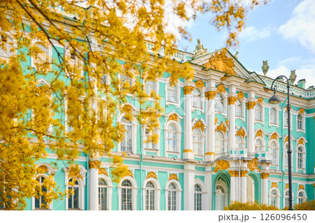 the incredibly picturesque facade of the Winter Palace through the branches of trees on a clear spring day, the heritage of Russia, the most famous landmark of St. Petersburg, the museum the incredibly picturesque facade of the Winter Palace through the branches of trees on a clear spring day, the heritage of Russia, the most famous landmark of St. Petersburg, the museum 126096450