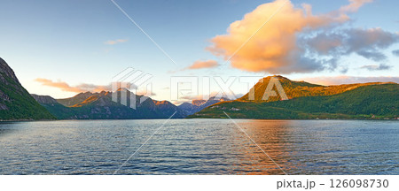 Sky, ocean landscape and nature with mountain for travel location, natural environment and vacation destination. Clouds, sea background and sunset scenery with hills, greenery and holiday adventure 126098730