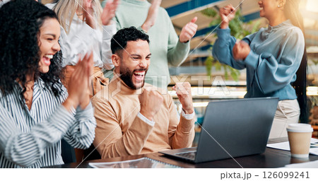 Fist pump, laptop and businessman with team for winning, bonus or creative proposal approval. Excited, people and success with happy applause, celebration or collaboration funding at startup office 126099241