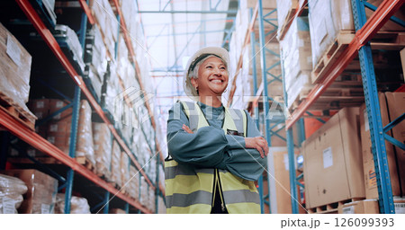 Warehouse, confidence and woman in logistics inventory with boxes, arms crossed and stock management. Low angle, smile and mature worker in cargo storage, global export and supply chain distribution 126099393
