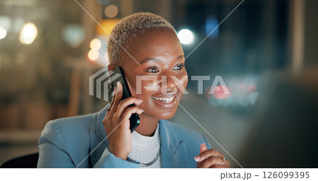 Black woman, computer and phone call in office at night for discussion, finance chat and schedule update. Person, mobile and communication of contact, financial feedback and funding offer of overtime 126099395