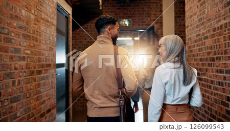 Walking, back and teamwork with business people in office for partnership, discussion and support. Advice, communication and feedback with employees in agency for coworking and commitment together 126099543