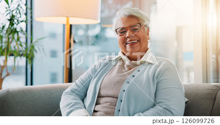 Elderly woman, smile and portrait on sofa for relax, comfort and glasses in retirement. Senior person, wellness and laugh in home living room with prescription eyewear, pensioner and happy for vision 126099726