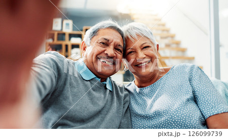 Old couple, portrait and selfie in home with happiness together, marriage and commitment with memory. Senior, man and woman with smile for love in picture, photography and retirement post in house Old couple, portrait and selfie in home with happiness together, marriage and commitment with memory. Senior, man and woman with smile for love in picture, photography and retirement post in house 126099739