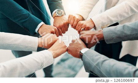 Fist bump, hands and business people in huddle for support, mission and team cooperation in circle. Corporate community, solidarity or synergy with group for partnership, agreement and deal together 126100697