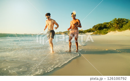 Running, beach and men with vacation, friends and bonding together with tropical island. Traveller, ocean and people with cardio, shoreline and summer holiday with weekend break, energy and Zanzibar 126100792