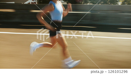 Motion blur, fitness and body of woman running on bridge in city for race, marathon or training. Sports, speed and female athlete on highway with cardio workout, challenge or exercise in town. 126101296