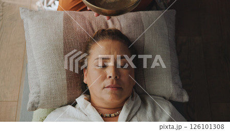 Relax, singing bowl and woman at guided meditation class for mindfulness, calm and balance practice. Above, yoga nidra and female person at sound therapy session for wellness, health or release 126101308