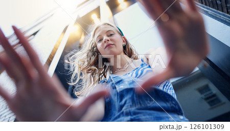 Below, hand frame and portrait of girl in city with confidence for style, trendy or outfit. Low angle, perspective and selfie of person in town for fashion, aesthetic and picture for photography Below, hand frame and portrait of girl in city with confidence for style, trendy or outfit. Low angle, perspective and selfie of person in town for fashion, aesthetic and picture for photography 126101309
