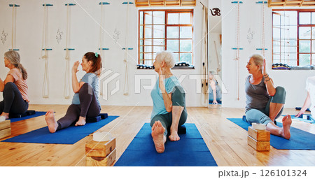 Group, senior people and exercise for yoga for fitness, flexibility and spiritual wellness. Elderly women, seated twist pose and community pilates, holistic practice and body balance at health club Group, senior people and exercise for yoga for fitness, flexibility and spiritual wellness. Elderly women, seated twist pose and community pilates, holistic practice and body balance at health club 126101324