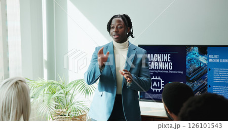 Businessman, talking and presentation of idea in conference room for ai innovation or machine learning. Speaker, meeting or pitch proposal to group for computer science, tech or development in office 126101543