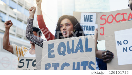Solidarity, woman and crowd protest with poster for equal rights, government change and social justice with unity. Group, shouting and fist with cardboard in city for inequality movement and freedom 126101733