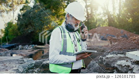 Building, radio and tablet with construction worker man on site for communication, development or planning. Earmuffs, excavation and hardhat with builder person outdoor for industrial engineering 126101785