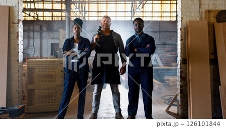 Demolition, hammer and portrait of people in warehouse for building remodel. Contractor, renovation and tool with confident or serious team in factory of construction industry for lumber occupation 126101844
