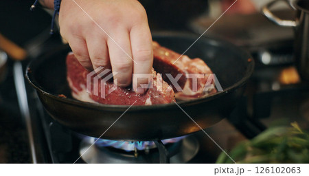 Cooking, hands and chef with steak in pan in kitchen for culinary skill, recipe and meal prep for dinner. Food, frying and person with beef, meat and sauce for gourmet dish, ingredients and cuisine 126102063